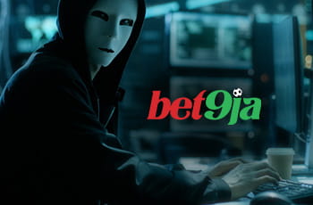 A picture of a hacker with the Bet9ja logo displayed on the computer screen