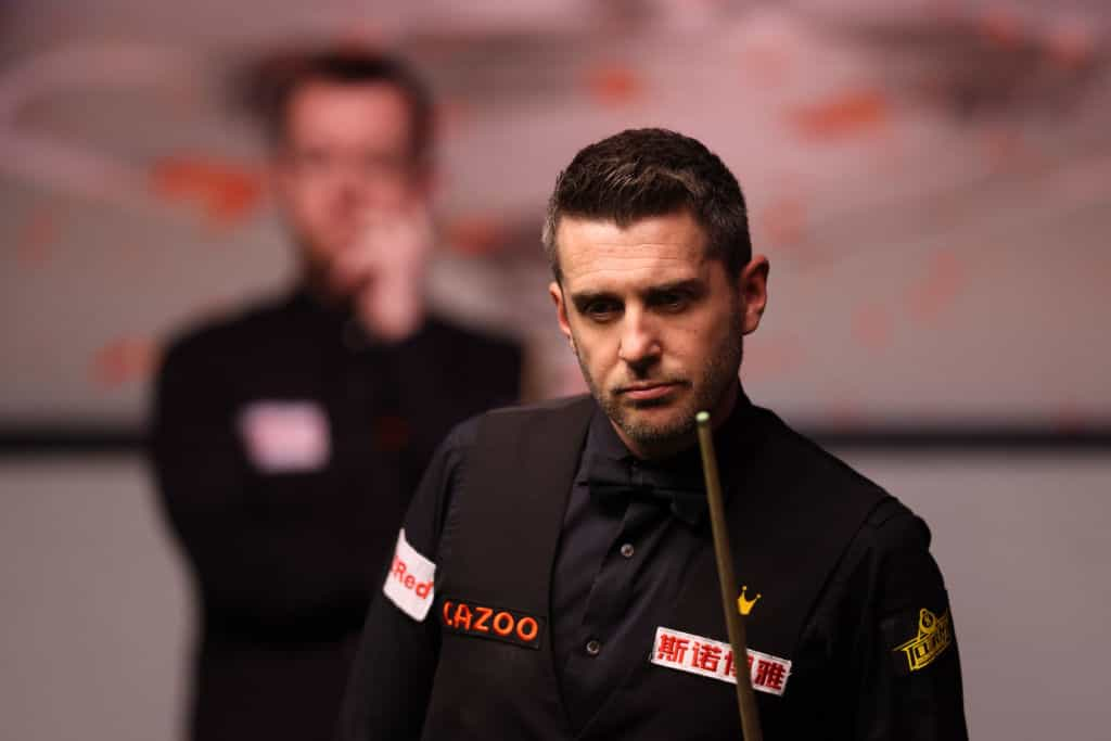 Snooker star Mark Selby contemplates a shot.