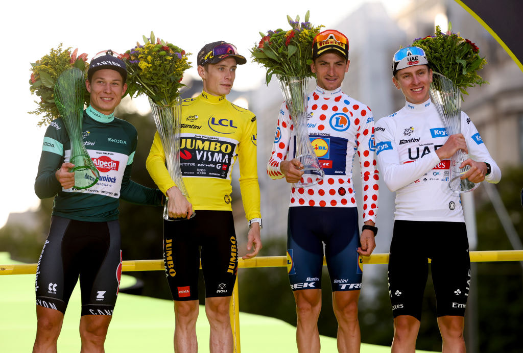 The four jersey winners at the 2023 Tour De France stand on the winner's podium in Paris. 