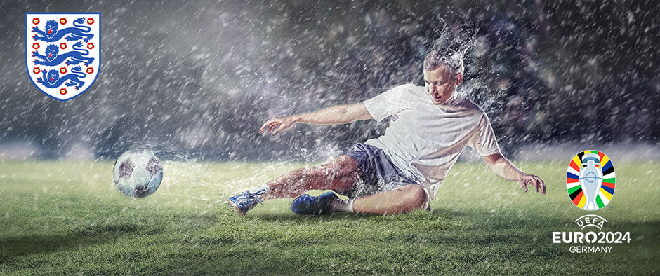 A football player in a white kit heading a ball on a wet pitch with water splashing around him. The England national team logo is on the left, and the UEFA Euro 2024 Germany logo is on the right. The background shows a stadium filled with spectators under a night sky.