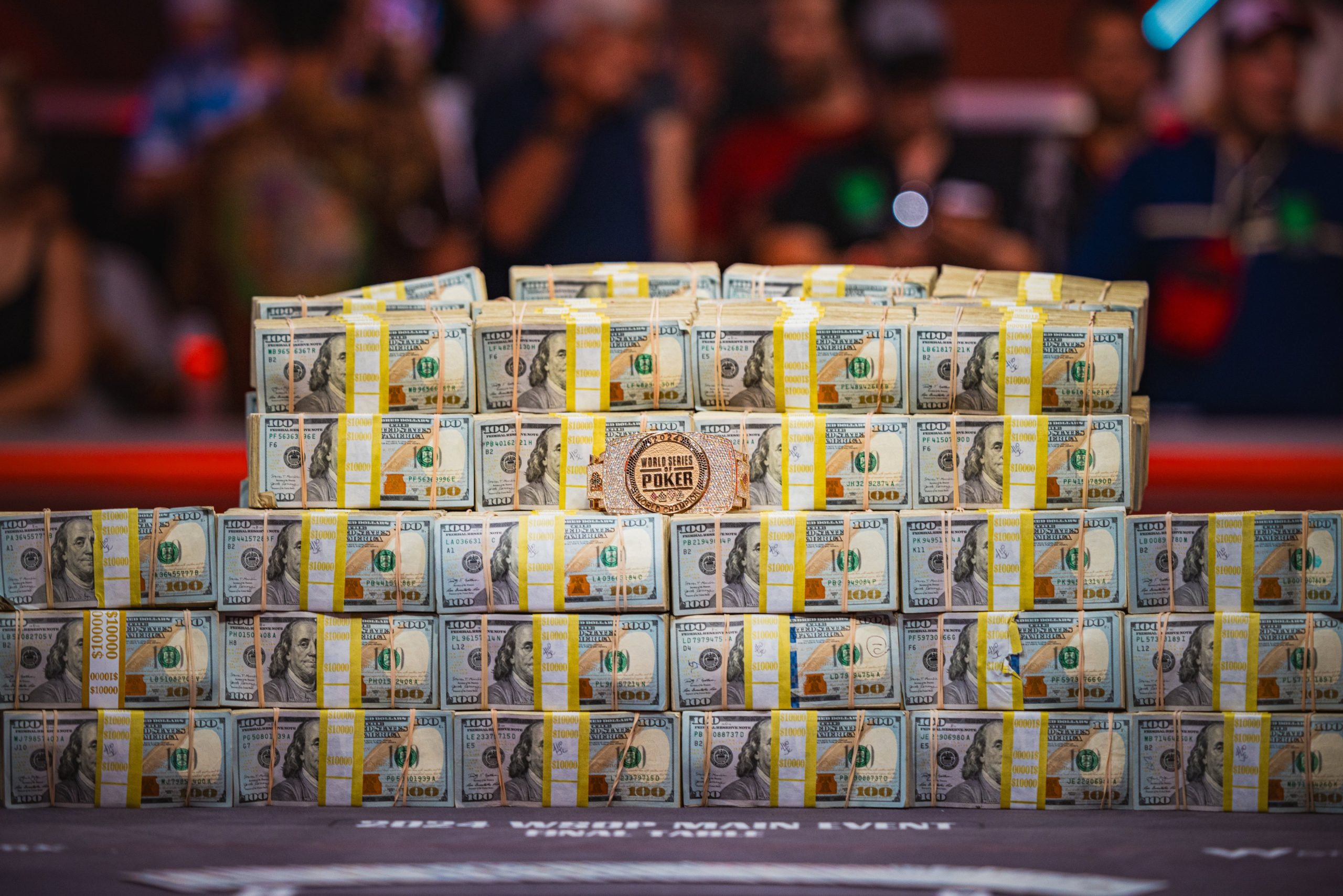 Piles of cash and the 2024 WSOP winner’s bracelet. 