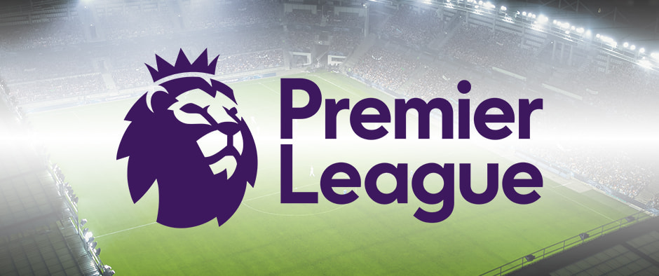 The Premier League logo is over a brightly lit football stadium with a full crowd in the stands, and it is viewed from an elevated angle.