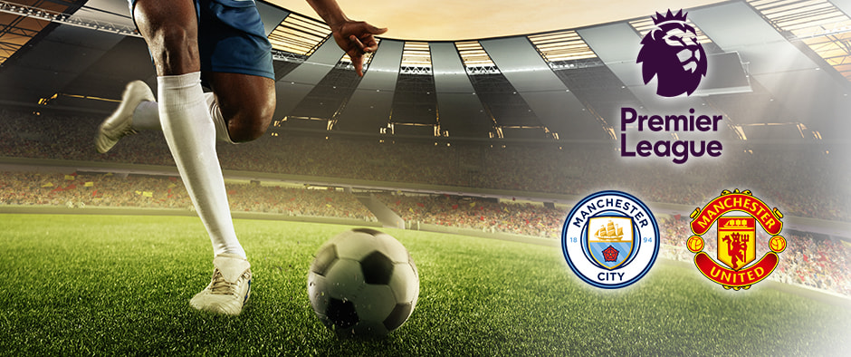 A football player in blue kit prepares to kick a ball on a green pitch. The Premier League logo is displayed alongside the Manchester City and Manchester United club logos in a stadium setting.