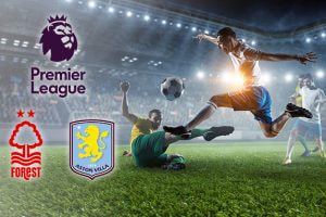 Players in action on a football pitch under stadium lights. The Premier League logo is displayed alongside the Nottingham Forest and Aston Villa club logos.