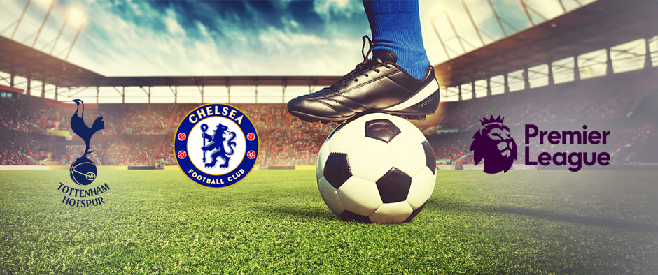 A football player in blue socks stands with a ball on a pitch in a stadium. The Tottenham Hotspur and Chelsea logos are displayed alongside the Premier League logo.