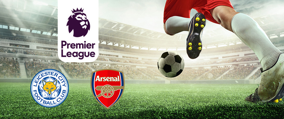 A dynamic football scene in a stadium with a player in red shorts and white socks poised to kick a soccer ball on the grass. The Premier League logo is displayed to the left, along with the logos of Leicester City Football Club and Arsenal Football Club, highlighting their upcoming match amidst an audience-filled environment.